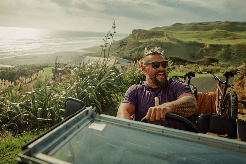 Rolling on the coast near the Awhitu Peninsula in his 1948 Land Rover. Get Jason’s Look: So iLL x On the Roam, by Jason Mamoa Tee; So iLL x On the Roam, by Jason Mamoa Sunglasses
JASON ROMAN