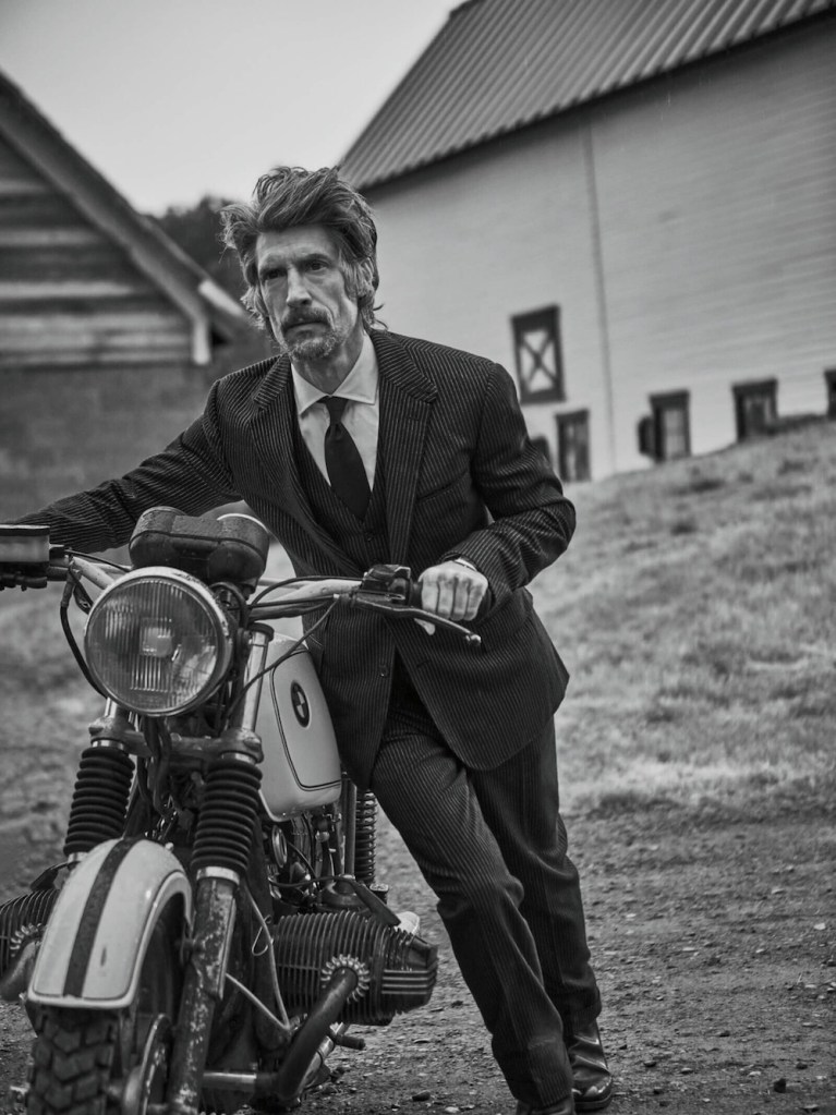 Three-piece suit ($3,695), shirt ($495), and boots ($995) by Ralph Lauren Purple Label; tie ($275) by Charvet; Tank Américaine watch ($5,050) by Cartier.