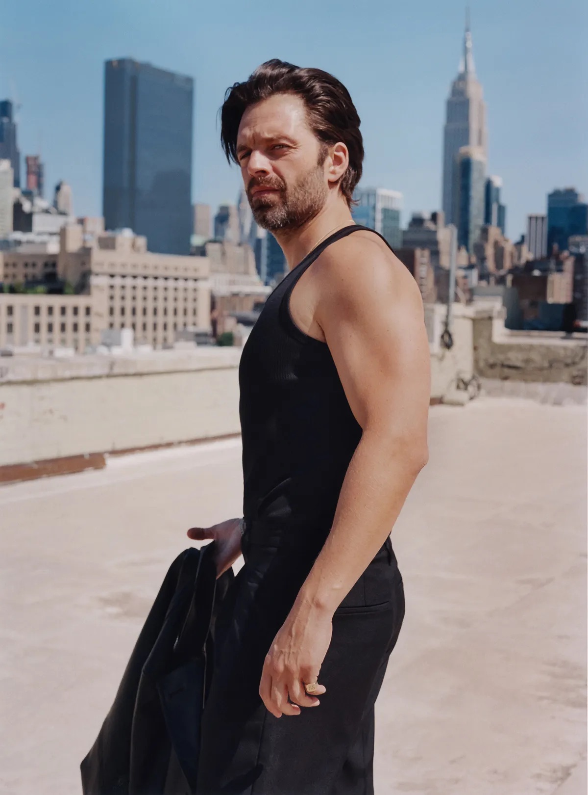 We’re sitting over coffee in Manhattan. Stan is dressed down in a black chore coat and black tee, yet he’s anything but a casual conversation partner. He rarely breaks eye contact, doing so only on the occasions when he has something he wants to show me on his iPhone (cracked screen, no case). In this instance, it’s folders of photos and videos labeled “DT” and “DT PHYSICALITY.”
“I had 130 videos on his physicality on my phone,” Stan says. “And 562 videos that I had pulled with pictures from different time periods — from the ’70s all the way to today — so I could pull out his speech patterns and try to improvise like him.” Stan, deep in character, would ad-lib entire scenes at director Ali Abbasi’s urging, drawing on the details he’d learned from watching Trump and reading interviews to understand precisely how to react in each moment.
“Ali could come in on the second take and say, ‘Why don’t you talk a little bit about the taxes and how you don’t want to pay?’ So I had to know what charities they were going to in 1983. Every night I would go home and try not only to prepare for the day that was coming, but also to prepare for where Ali was going to take this.”
Looking at Stan’s phone, among the endless pictures of Trump, I glimpse thumbnails of Stan’s own face perched in a Trumpian pout and videos of the actor’s preparation just aching to be clicked — or to be stored in the Trump Presidential Library when this is all over in a few months, or in 2029, or beyond.
“I started to realize that I needed to start speaking with my lips in a different way,” Stan says. “A lot of that came from the consonants. If I’m talking, I’m moving forward.” On film, Stan shapes his mouth like he can’t wait to get the plosives out, puckering without quite tipping into parody. “The consonants naturally forced your lips forward.”
“If he did 10% more of what he did, it would become ‘Saturday Night Live,’” Abbasi says. “If he did 10% less, then he’s not conjuring that person. But here’s the thing about Sebastian: He’s very inspired by reality, by research. And that’s also the way I work; if you want to go to strange places, you need to get your baseline reality covered very well.”
A little later, Stan passes me the phone again to show me a selfie of him posing shirtless and revealing two sagging pecs and a bit of a gut. He’s pouting into a mirror. If his expression looks exaggerated, consider that he was in Marvel-movie shape before stepping into the role of the former president; the body transformation happened rapidly and jarringly. Trump’s size is a part of the film’s plot — as Trump’s sense of self inflates, so does he. In a rush to meet the shooting deadline for “The Apprentice,” Abbasi asked Stan, “How much weight can you gain?”
“You’d be surprised,” Stan tells me. “You can gain a lot of weight in two months.” (Fifteen pounds, to be exact.)
Now he’s back in fighting form, but the character has stayed with him. After years of playing second-fiddle agents of chaos — goofball husbands to Margot Robbie’s and Lily James’ characters in “I, Tonya” and Hulu’s “Pam & Tommy,” surly frenemy to Chris Evans’ Captain America in the Marvel franchise — Stan plunged into the id of the man whose appetites have reshaped our world. He had to have a polished enough sense of Trump that he could improvise in character, and enough respect for him to play him as a human being, not a monster.