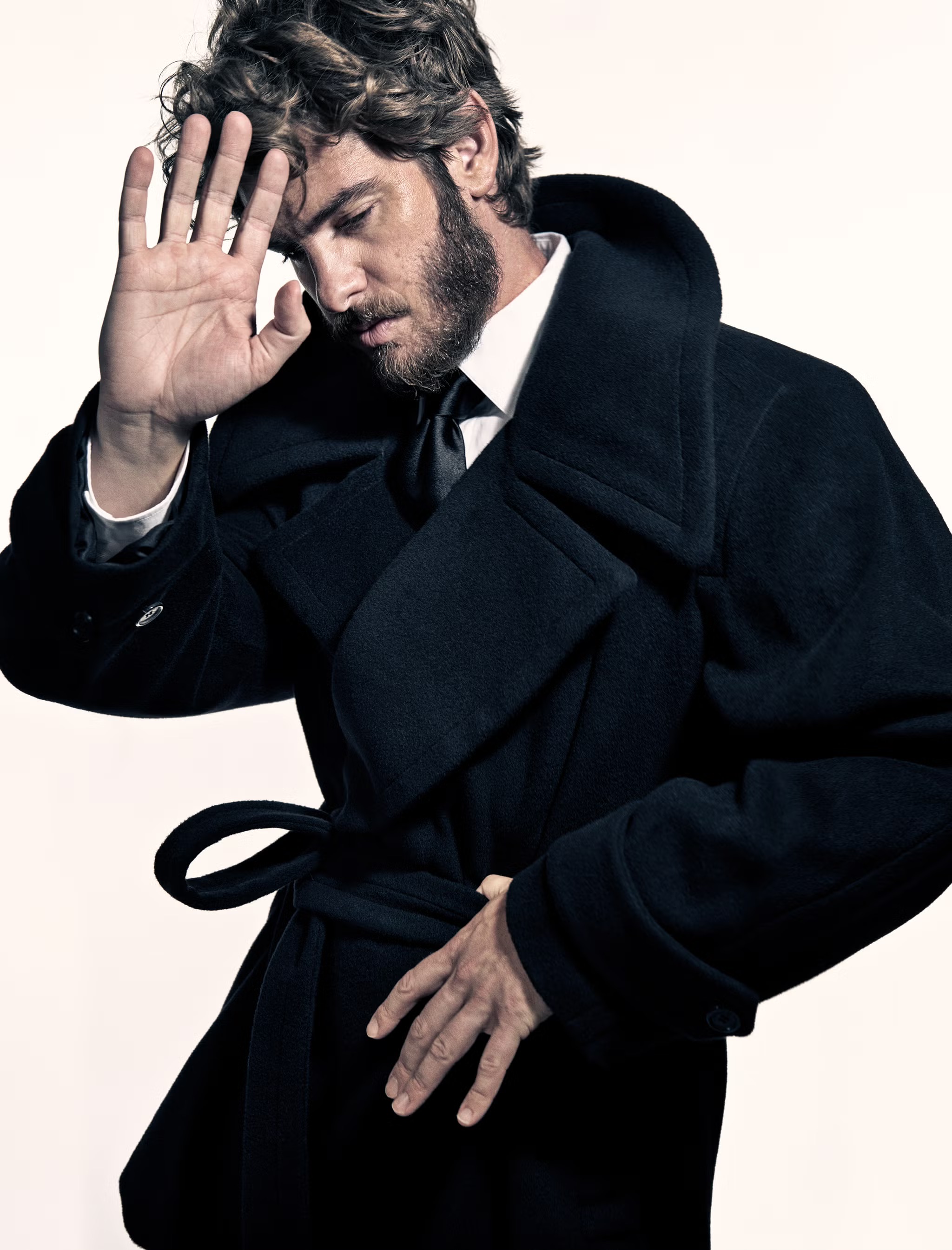 Andrew Garfield discusses his evolving career, exploring his roles in ‘We Live in Time’ and ‘Spider-Man,’ and the personal challenges and joys of balancing fame and artistry.